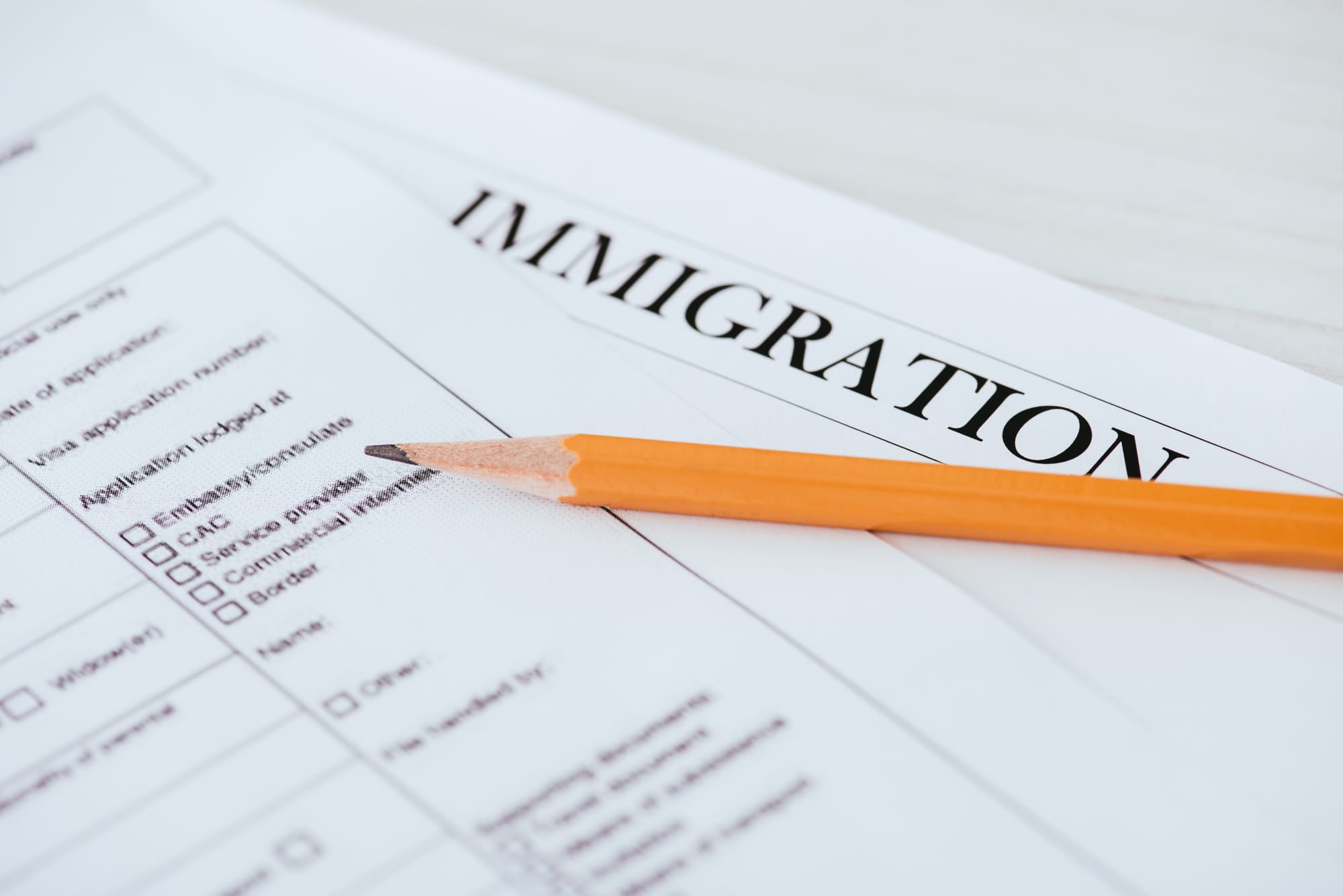 Immigration application form with pencil